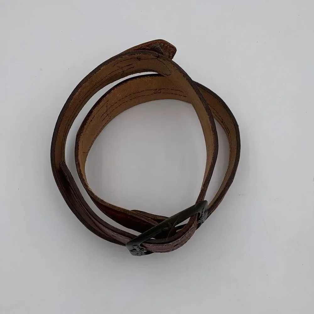 Brown Leather western style belt with braided leather and denim.